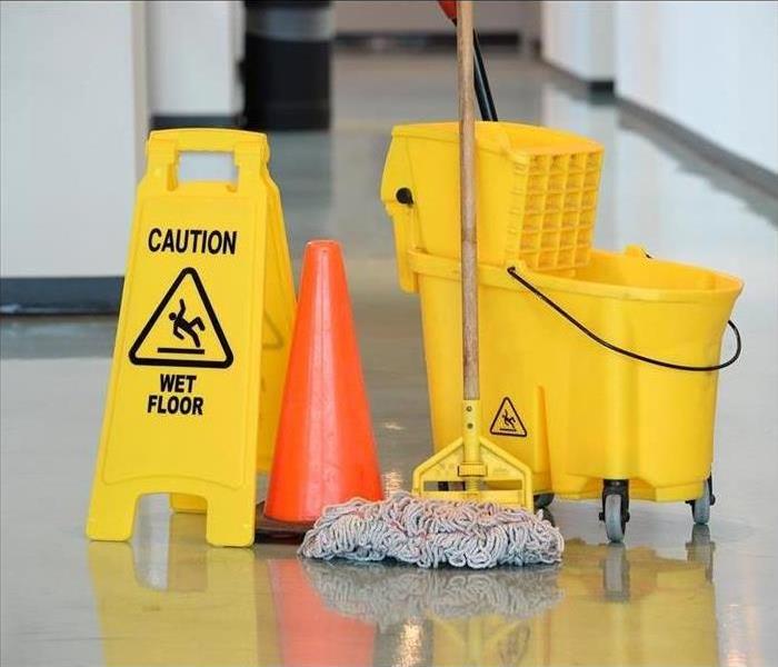 Mop and Bucket on a tile floor